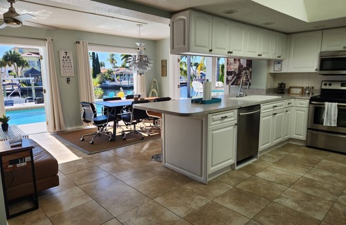Gulf Harbors House | Outdoor lovers dream home- Pool, outdoor kitchen, private dock, and so much more