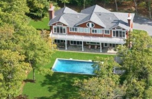 East Hampton House | OVERLOOKING THREE MILE HARBOR, DOUBLE-HEIGHT FOYER WITH CHANDELIER,.