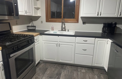 Walloon Lake Cabin | Peaceful cabin hideaway with fire pit & hot tub only 3 blocks from Walloon Lake
