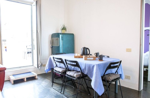 Monti Apartment | Penthouse with large terrace overlooking Colosseum and center of Rome.