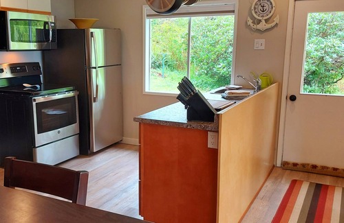 Heriot Bay Apartment | Perfect getaway. Spectacular mountain and ocean view. Steps to the beach.