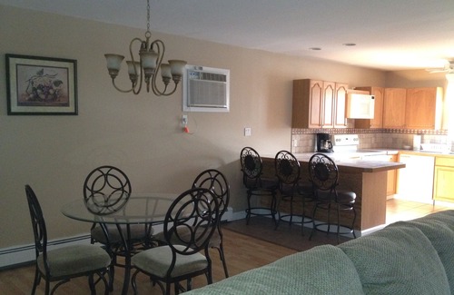 Hampton Bays Apartment | Pet Friendly! Spacious town house style open concept. Salt Water Pool & HotTub