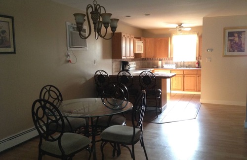 Hampton Bays Apartment | Pet Friendly! Spacious town house style open concept. Salt Water Pool & HotTub