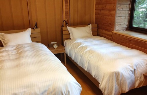 Kita Karuizawa Cabin | Pets, BBQ, bonfires OK! Spacious Kita-Karuizawa Rental Villa with Fireplace 'Musasabi House