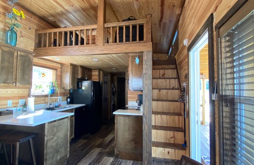 New London House | Phoenix Tiny House at Badin Shores Resort, lake view, porch, pool, beach, marina