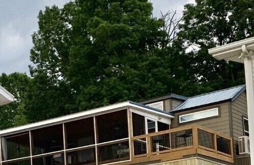 New London House | Phoenix Tiny House at Badin Shores Resort, lake view, porch, pool, beach, marina