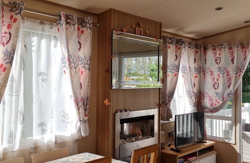 Tattershall House | Picturesque Lakeside 6 Berth Caravan with a private fishing peg