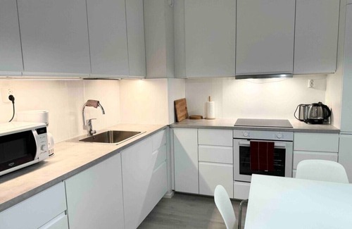 Koillinen District Condo | #PIHLAJISTO · Spacious 4-bedroom condo with patio, free parking