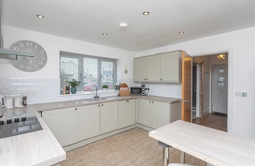 Rhoscolyn House | PINE CONES, with a garden in Four Mile Bridge