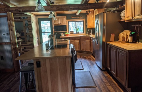 Dunbar Cabin | Private 3 BR 1.5 BA log cabin on 34 acres, driveway is 150' from ATV trail