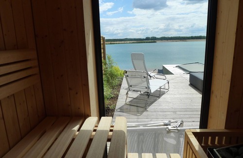 Lobnitz House | Private beach! House 'California' with fireplace, sauna & hot tub right on the lake