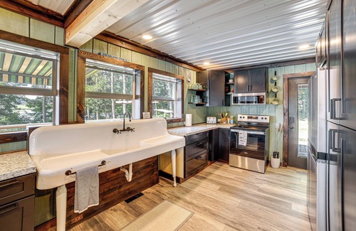 Smyrna Cabin | Private Island: Home in Belding w/Dock & Grill!