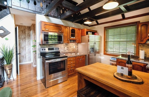 Yulan House | Private log cabin nestled at the base of a secluded wooded area n