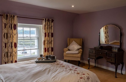 Laugharne Bed & Breakfast | Property looking at Dylan Thomas boat house and Laugharne Castle.