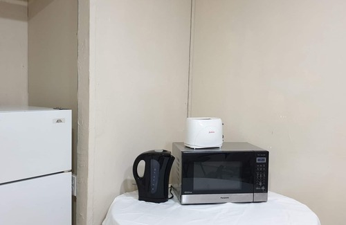 Port of Spain House | Queen's Comfort Inn