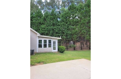 Newnan House | Quiet Lake Community with enclosed Lanai/sleeps 6