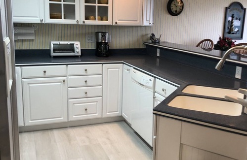 Boyne City Condo | RECENTLY REMODELED directly on Lake Charlevoix Boat Slip Pool Deck Walkout Wifi