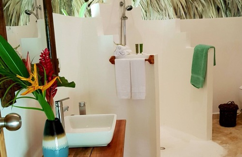 Samana Cabin | Regenerative tropical lodge with chic details , steps away from the beach.