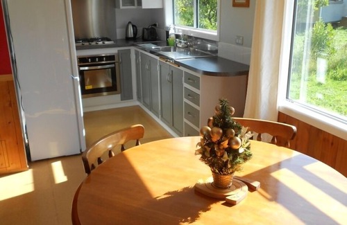 Kerikeri Cottage | Relax a Lodge MoonShine 2 Bedroom Cottage: farm animals, pool, organic orchard!