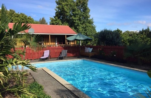 Kerikeri Cottage | Relax a Lodge MoonShine 2 Bedroom Cottage: farm animals, pool, organic orchard!