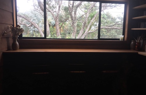Muriwai House | Relax in our Muriwai Sanctuary amongst the trees.