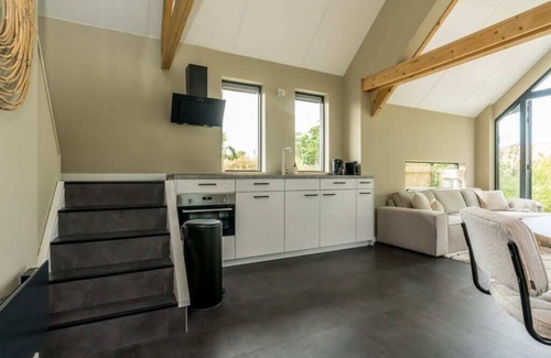 Westenschouwen House | Relax in this chalet, experience the spaciousness from the sofa, from the ridge beam to the surround