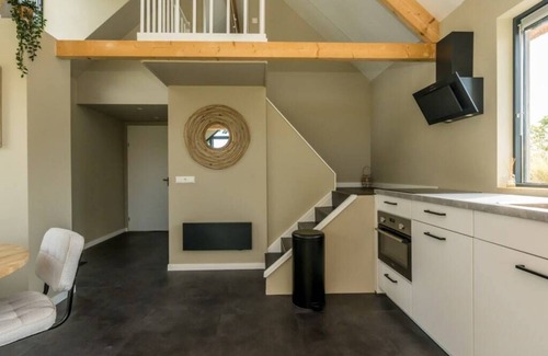 Westenschouwen House | Relax in this chalet, experience the spaciousness from the sofa, from the ridge beam to the surround