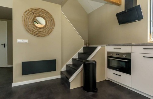 Westenschouwen House | Relax in this chalet, experience the spaciousness from the sofa, from the ridge beam to the surround