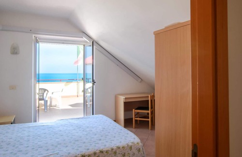Campofilone Apartment | Relax with a cool drink on your terrace overlooking the sea.