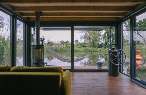 Bad Freienwalde Boat Rental | Relaxation on the water! 50sqm luxury houseboat in the middle of the nature of the Oderbruch
