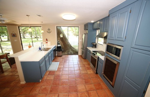 Cedar Lane House | Relaxing Caney Creek views or just minutes from the beach!