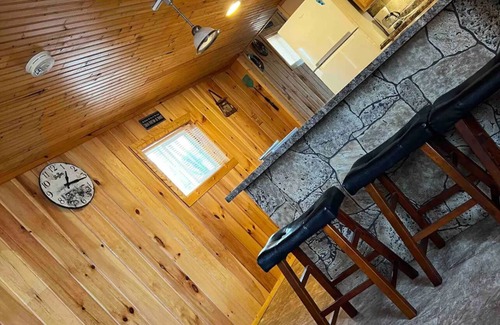 Manitou Beach House | Remodeled cozy retreat with a lake front view on Devils Lake. Pet Friendly!