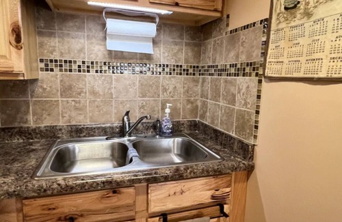 Manitou Beach House | Remodeled cozy retreat with a lake front view on Devils Lake. Pet Friendly!