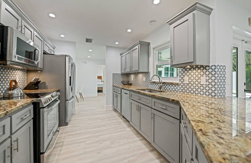 Bay Isle House | REMODELED, Heated Pool and Spa, POOL Table, games, bikes included!