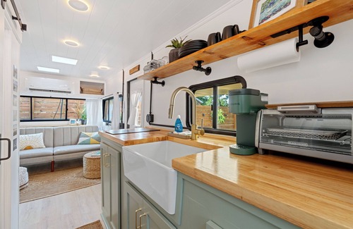 Navy Point House | Renovated 1970’s retro camper on Bayou Grande in Pensacola with walking trail.