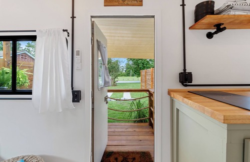 Navy Point House | Renovated 1970’s retro camper on Bayou Grande in Pensacola with walking trail.