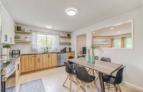 Crescent Heights Apartment | Renovated 3 bed, 2 bath! Walk downtown, HOT TUB and close to the Airport!