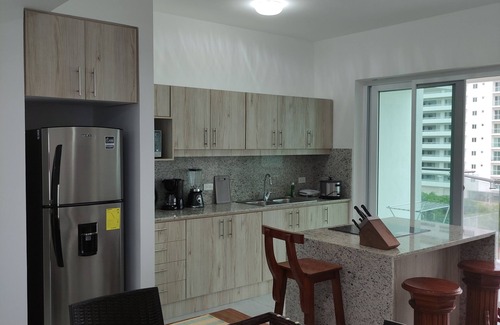 Tonsupa Apartment | Resort Playa Azul Tonsupa Apartment with a view of 2 rooms.