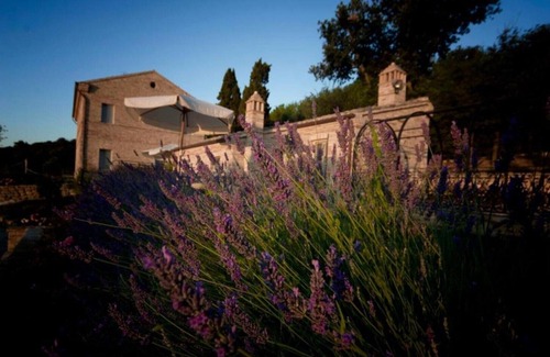 Potenza Picena Villa | Resort surrounded by greenery arranged for families or groups with an infinity pool.