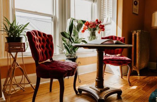 West Seventh Apartment | Retro Gem Box Victorian Steps from Irvine Park