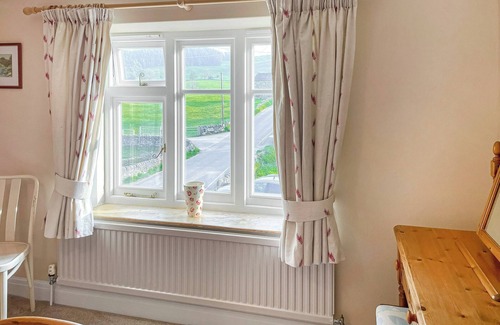 Youlgreave Cottage | River View sits beside the River Bradford with views of the hills and river.