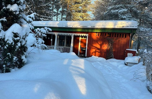 Aanekoski Ski Chalet | Riverfront cottage, sauna, hot tub, rowing boat, fishing, pets welcome.