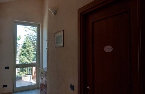 Patti Apartment | Room 'Lipari' with terrace, shared garden and air conditioning