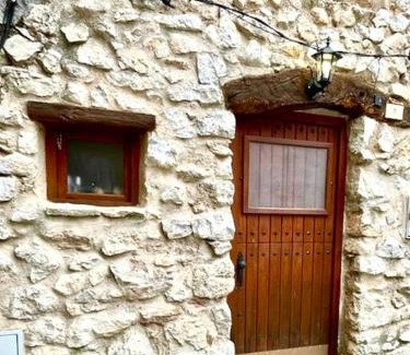 El Pinell de Brai House | Rural Stone House with wood fireplace