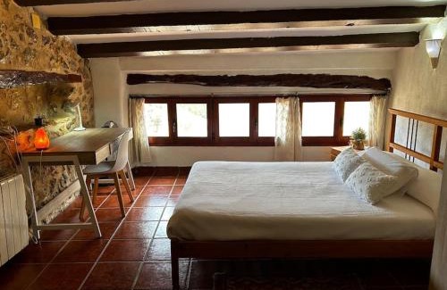 El Pinell de Brai House | Rural Stone House with wood fireplace