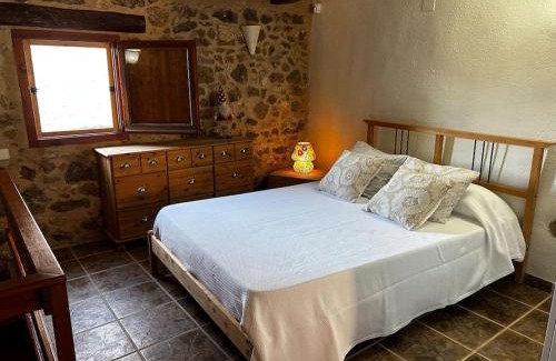 El Pinell de Brai House | Rural Stone House with wood fireplace