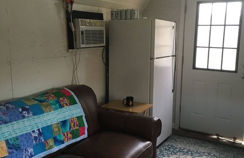 Navasota RV Rental | Rustic cabin hideaway above Hidalgo Falls on the Brazos River