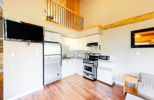 Lac Le Jeune Cabin | Rustic lakefront resort log cabin with deck, internet, and full kitchen
