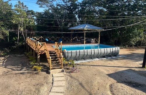 Burrell Boom House | Sade's Enchanted cabin Luxurious Jungle Cabin near the River with AC and WIFI