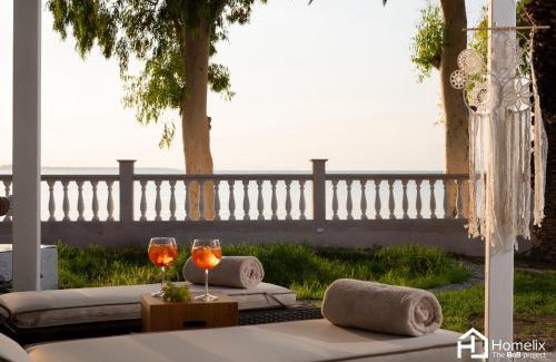 Chalcis House | Sandy Suite - seafront & luxury